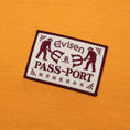 Load image into Gallery viewer, Passport X Evisen Logo Lock Up T-Shirt Orange Sorbet

