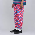 Load image into Gallery viewer, Nike SB X Parra QS Pants Gym Red / Pink Rise / Military Blue

