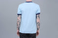 Load image into Gallery viewer, Passport Icy Hot Ringer T-Shirt Powder Blue / Navy
